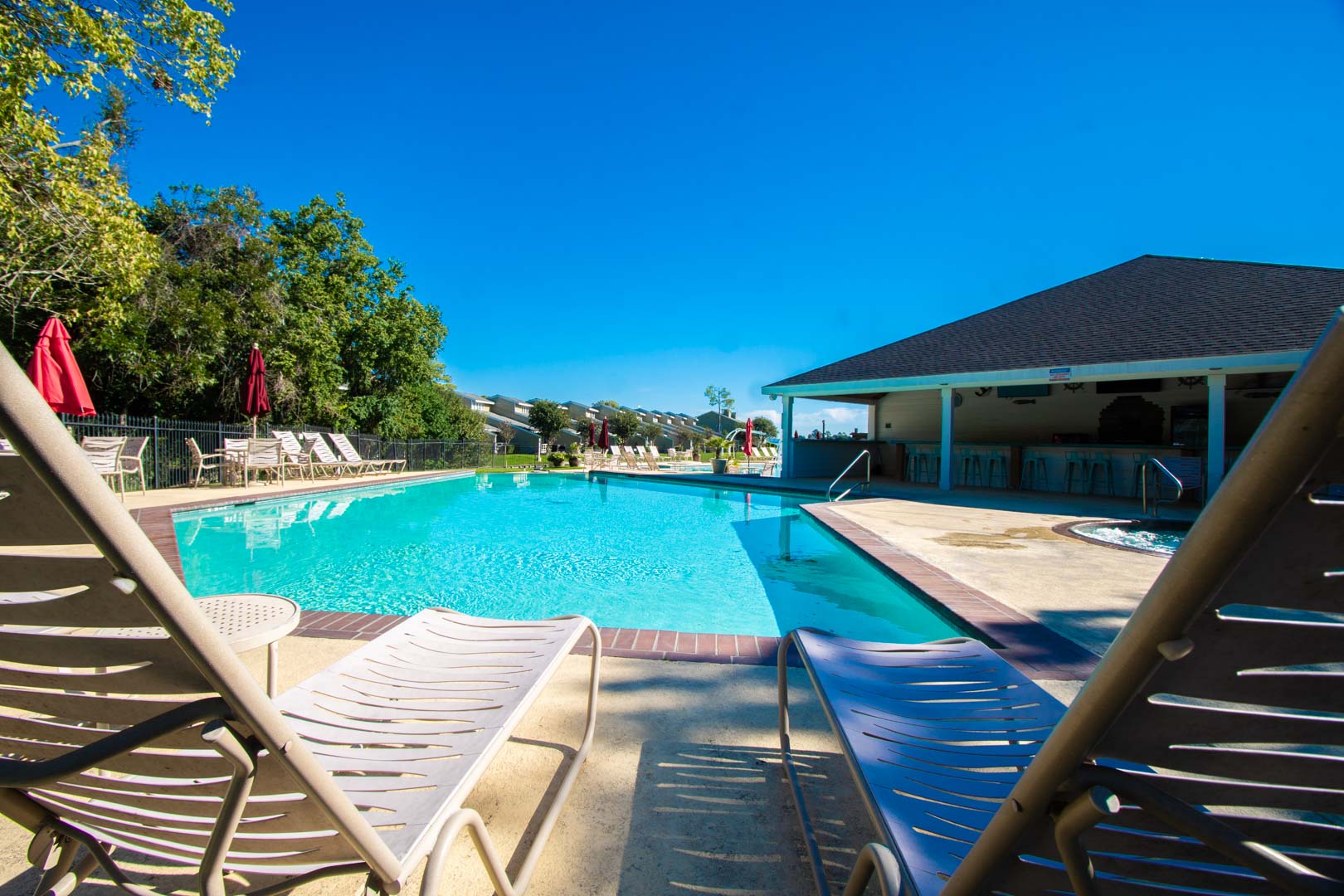 A spacious outdoor swimming pool at VRI's Sweetwater at Lake Conroe in Montgomery, TX.